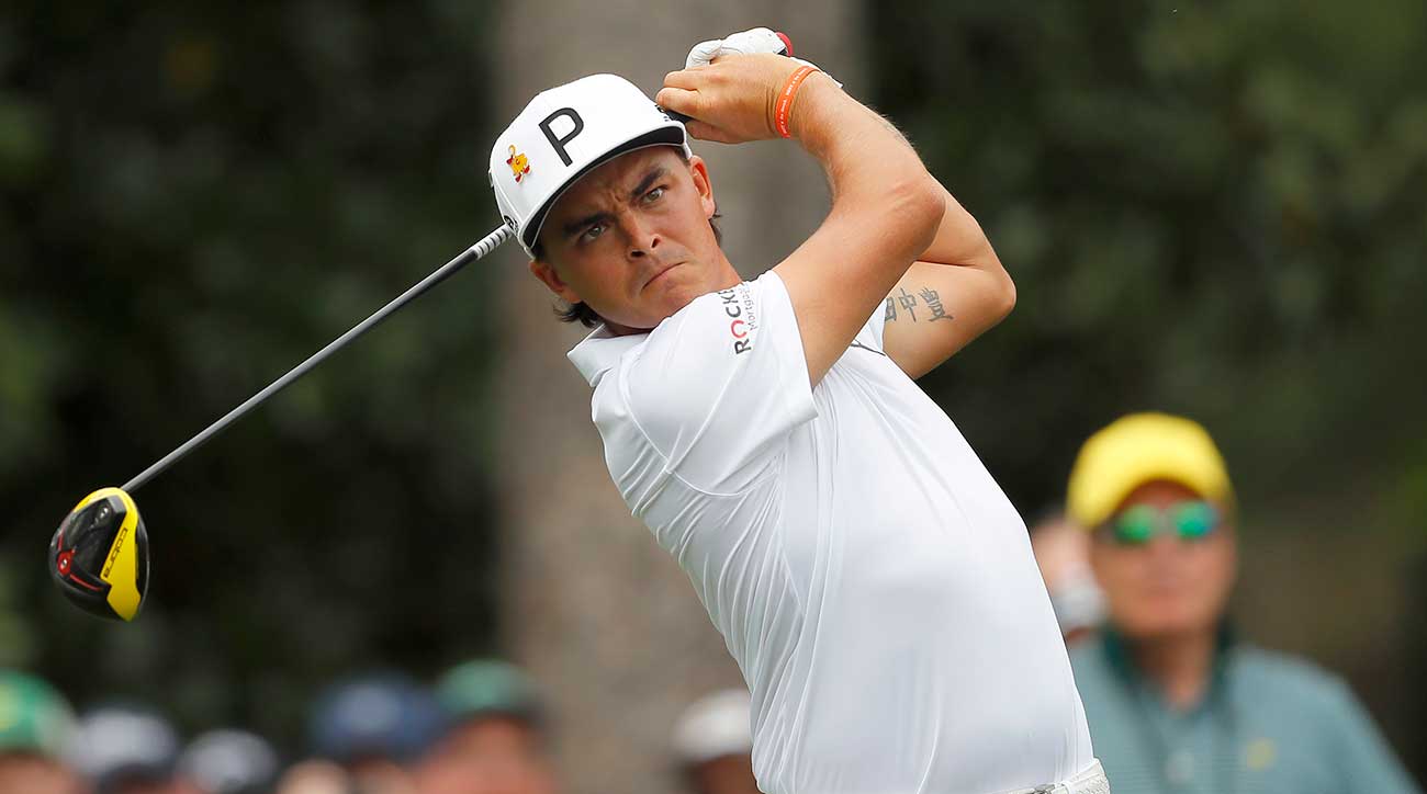 Rickie Fowler tees off during a Masters practice round.