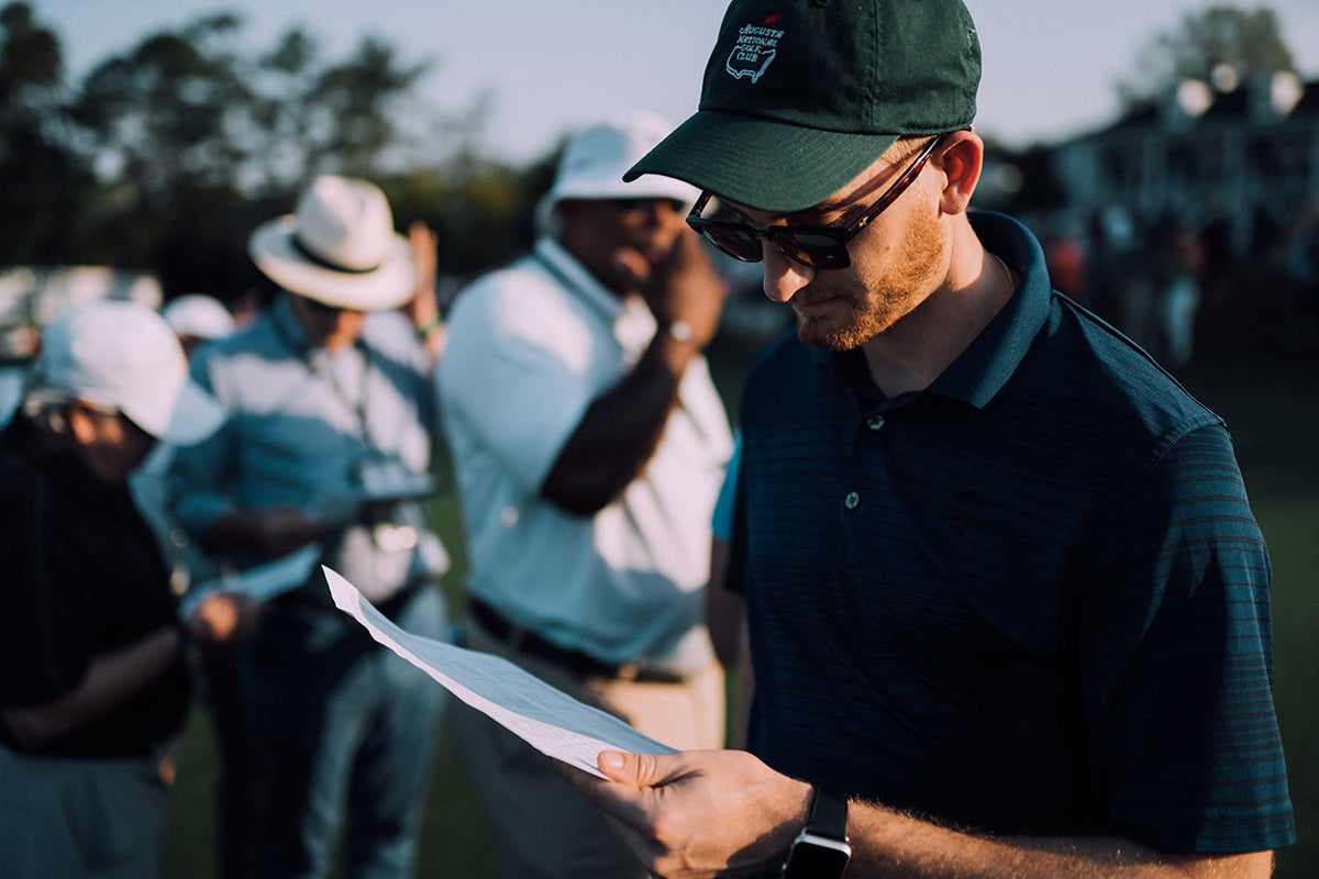 Patrons take in the day's schedule, analog of course.