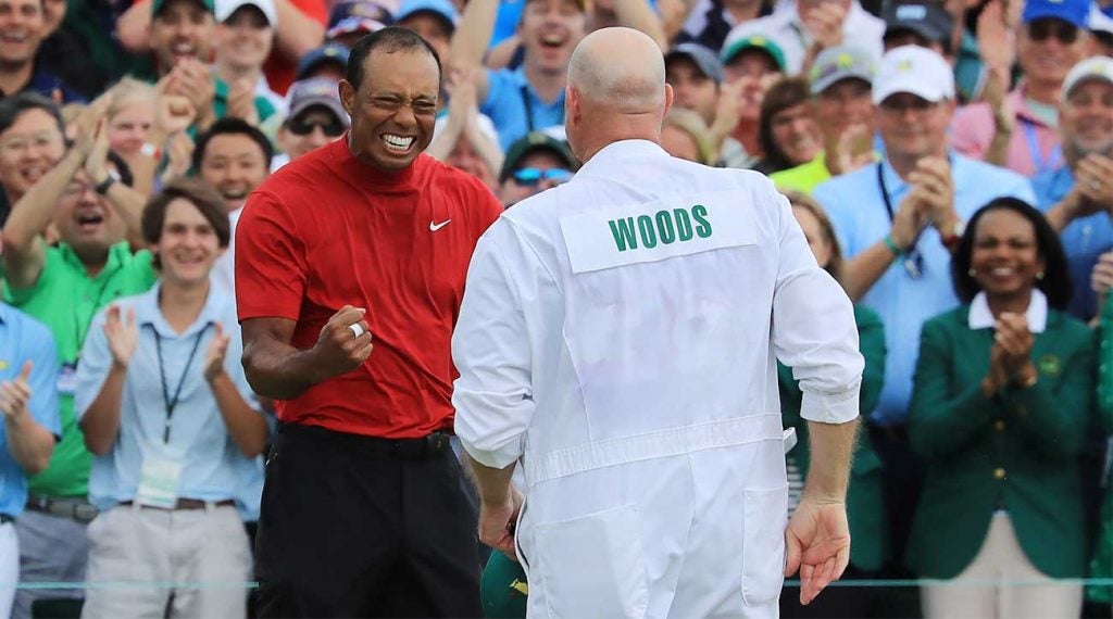 Tiger Woods and caddie Joe LaCava celebrate Woods's Masters victory.