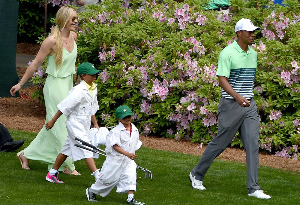 Tiger Woods and Lindsey Vonn with Woods's kids, daughter Sam (7 at the time), and son Charlie (6), as caddies at the 2015 Masters Par-3 Contest.