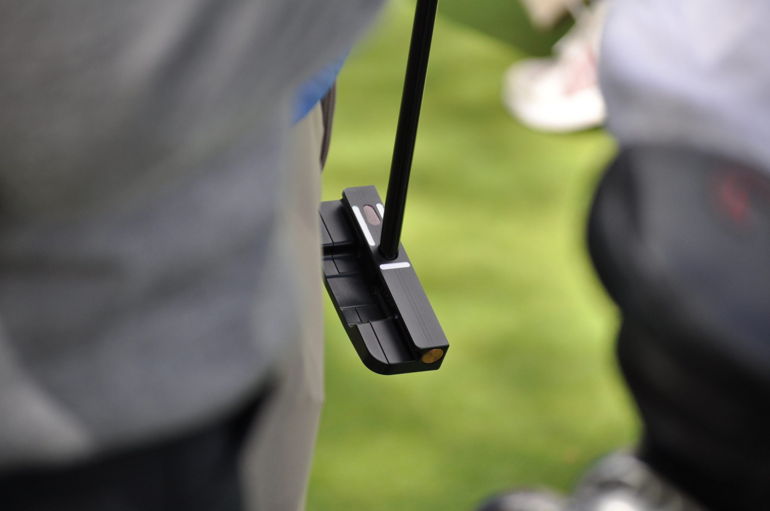 Zach Johnson tested a Seemore putter featuring a visible weight plug for toe hang purposes. 