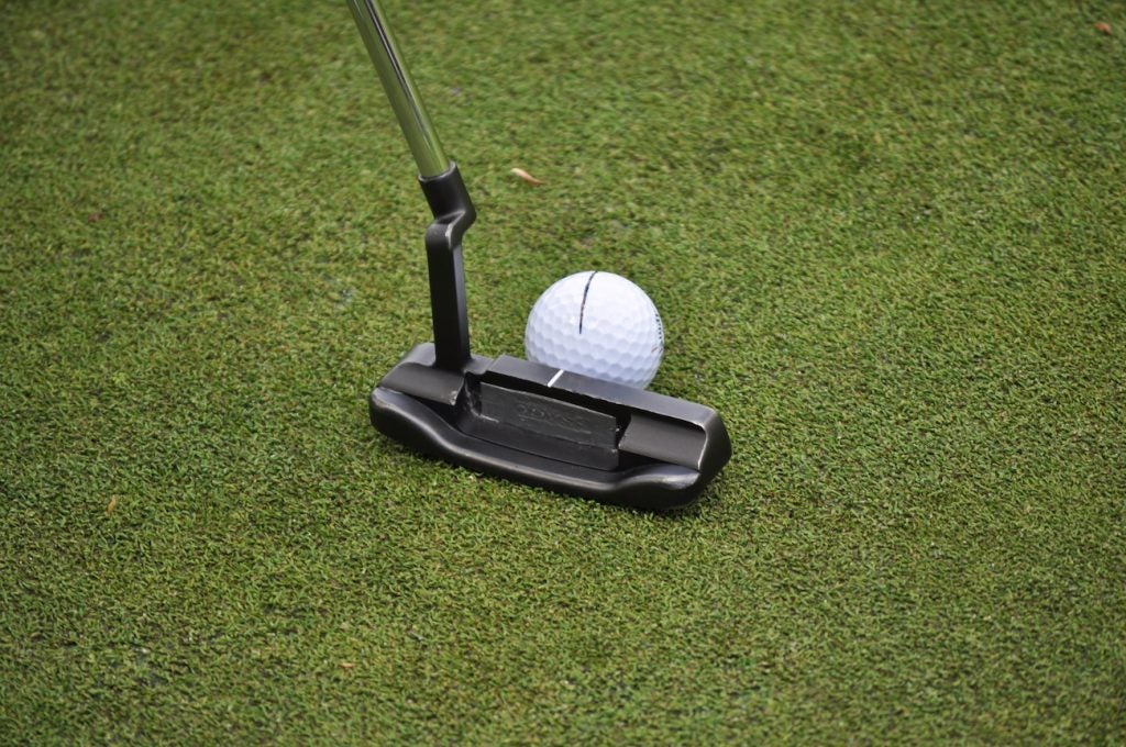 Si Woo Kim's Odyssey putter has a single strip of lead tape concealing the name in the cavity. 