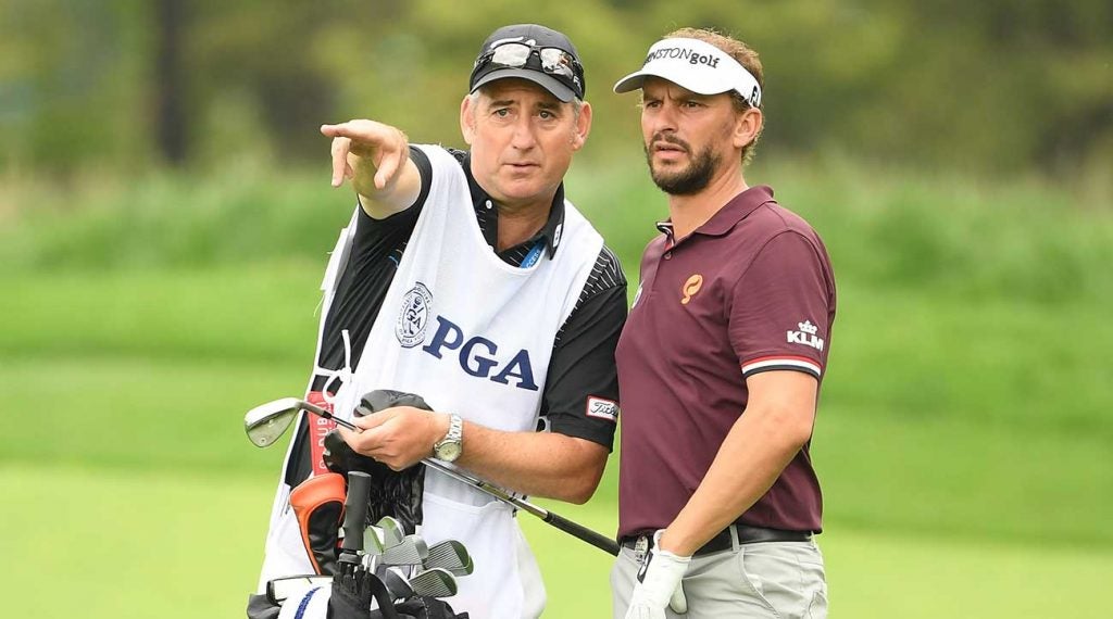 Joost Luiten and his caddie look over a shot during this week's PGA Championship.