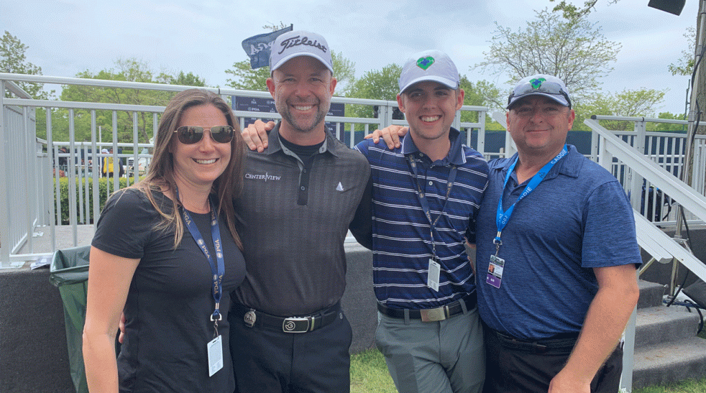 Rob Labritz poses in the scoring area with his wife, Kerry, son, Matthias, and caddie, Todd Luigi, after Labritz’s final round on Sunday.