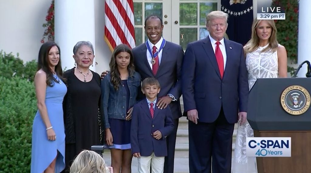 Tiger Woods poses with his girlfriend, mother and children alongside President Trump and Melania Trump.