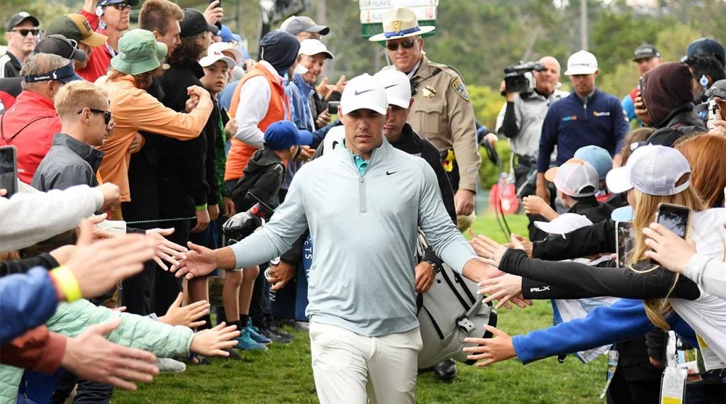 Brooks Koepka walks off the 13th green during the final round of the U.S. Open at Pebble Beach.