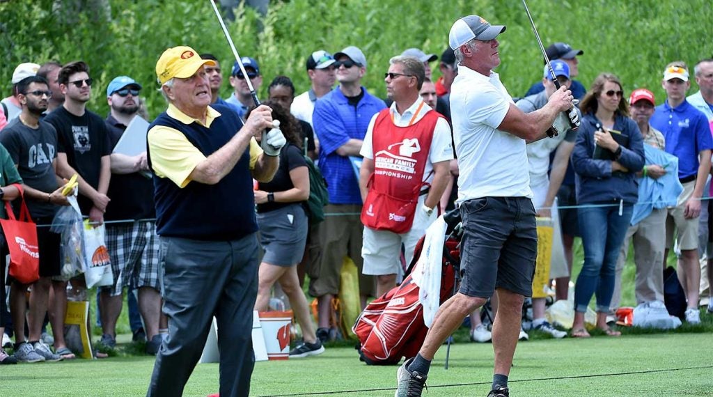 Jack Nicklaus and Brett Favre hit golf balls on the range together at the American Family Insurance Championship.