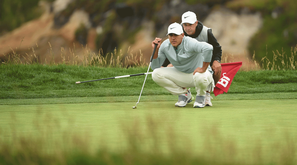 Brooks Koepka sizes up a putt in the fourth round at Pebble Beach.