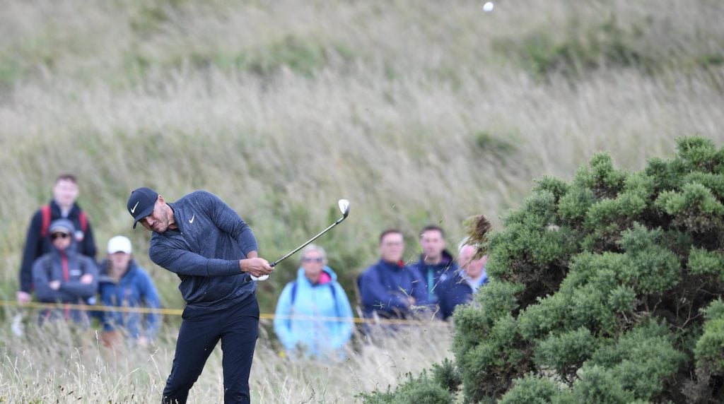 Brooks Koepka hits out of the rough on the 17th hole during the first round of the Open Championship at Royal Portrush Golf Club.
