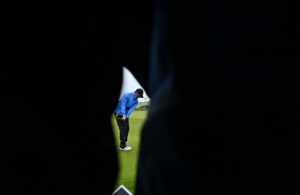 Antrim , United Kingdom - 17 July 2019; Rory McIlroy of Northern Ireland is seen through a gallery on the practice range during a practice round ahead of the 148th Open Championship at Royal Portrush in Portrush, Co. Antrim. (Photo By Brendan Moran/Sportsfile via Getty Images)