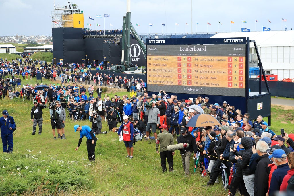 Rory McIlroy takes a penalty drop on the first hole during the first round of the 148th Open Championship.