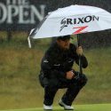 PORTRUSH, NORTHERN IRELAND - JULY 21: Shane Lowry of Ireland shelters from the rain as he lines up a putt on the eighth green during the final round of the 148th Open Championship held on the Dunluce Links at Royal Portrush Golf Club on July 21, 2019 in Portrush, United Kingdom. (Photo by Mike Ehrmann/Getty Images)
