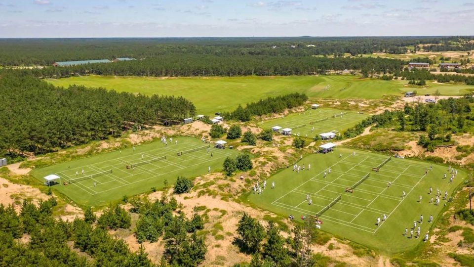 Even golfers would appreciate the grass tennis courts at Sand Valley