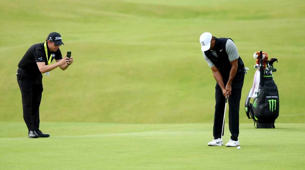 Matt Killen takes a photo of Tiger Woods' putting stroke at Portrush on Tuesday.