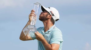 Matthew Wolff kisses the 3M Open trophy after winning on Sunday in Minnesota.