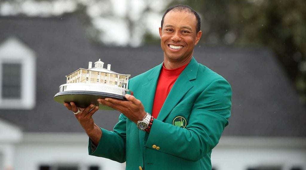 Tiger Woods holds up his Masters trophy after winning his fifth green jacket.