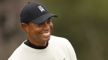Tiger Woods smiles during a practice round.
