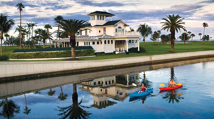 Two guests kayak at at Gasparilla Inn and Club.