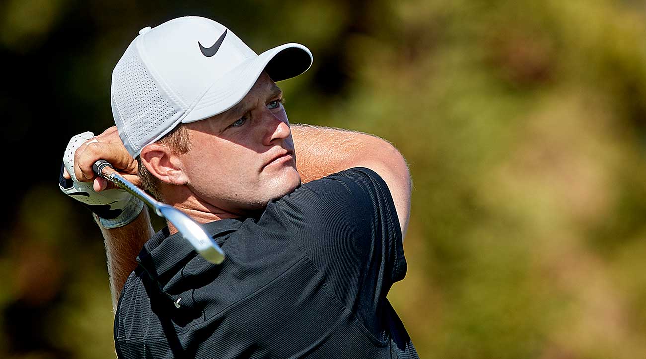Tom Lewis takes a swing during a tournament.