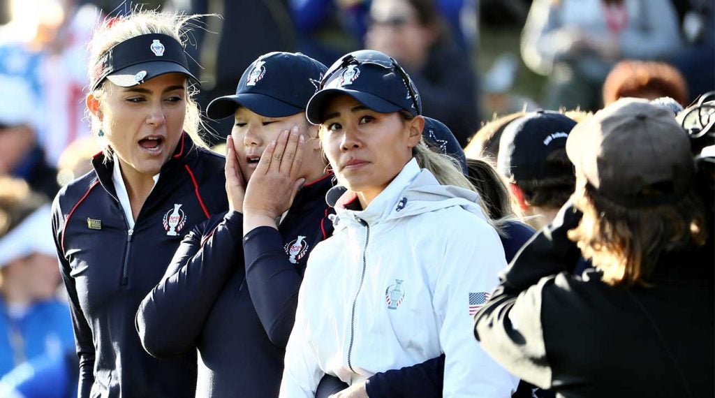 Lexi Thompson (from left), Angel Yin and Danielle Kang watch the final minutes of the U.S. Solheim Cup team's loss to Europe on Sunday at Gleneagles in Auchterarder, Scotland.