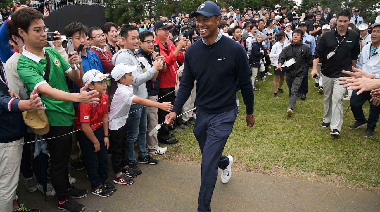 Tiger Woods smiles while walking to the eighth tee box during the MGM Resorts The Challenge: Japan Skins at Accordia Golf Narashino Country Club on Monday.