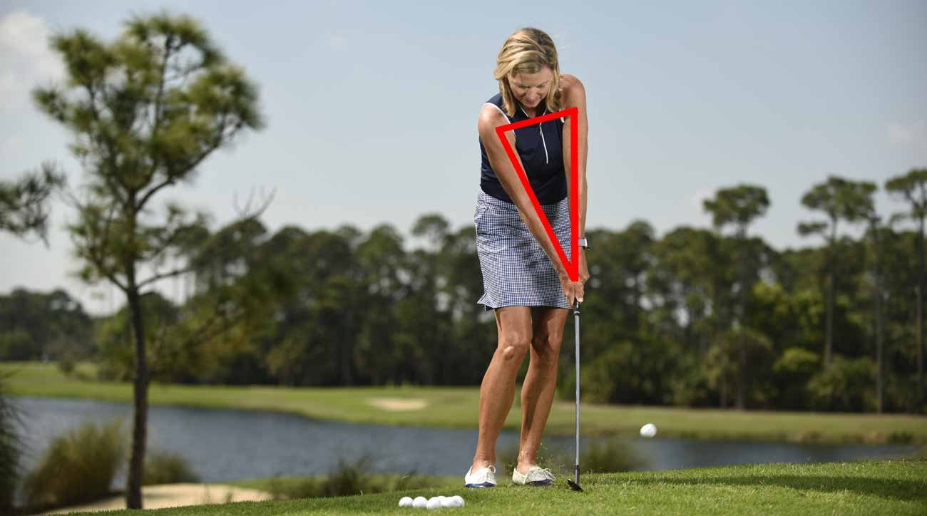 Maintain the triangle formed by your shoulders and arms at address throughout your motion. The club will hug the ground and catch every chip super-crisp.