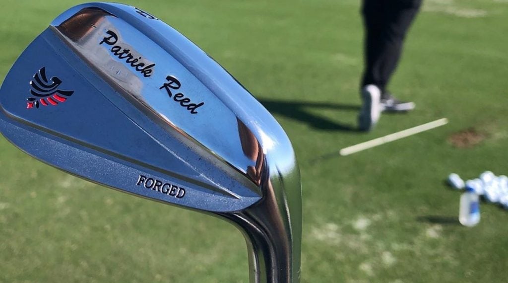 Patrick Reed's custom irons have his name and foundation logo on the head.