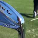 Patrick Reed's custom irons have his name and foundation logo on the head.