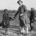 A golfer and his bagman — well, bagboy — circa 1922.