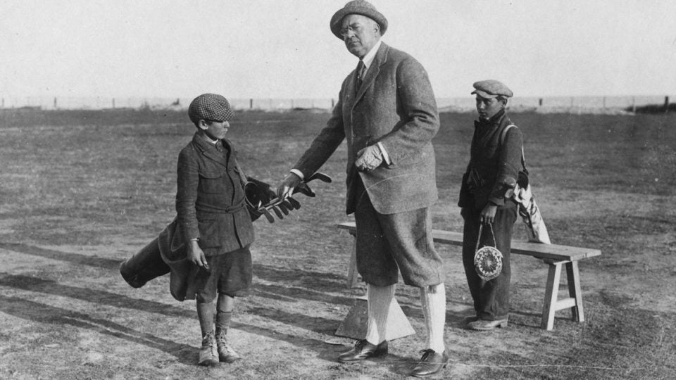 A golfer and his bagman — well, bagboy — circa 1922.