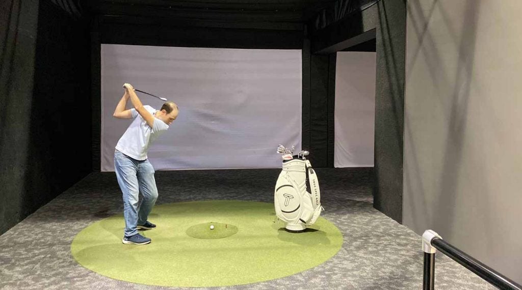 Warming up prior to a club fitting at True Spec Golf's New York City location.