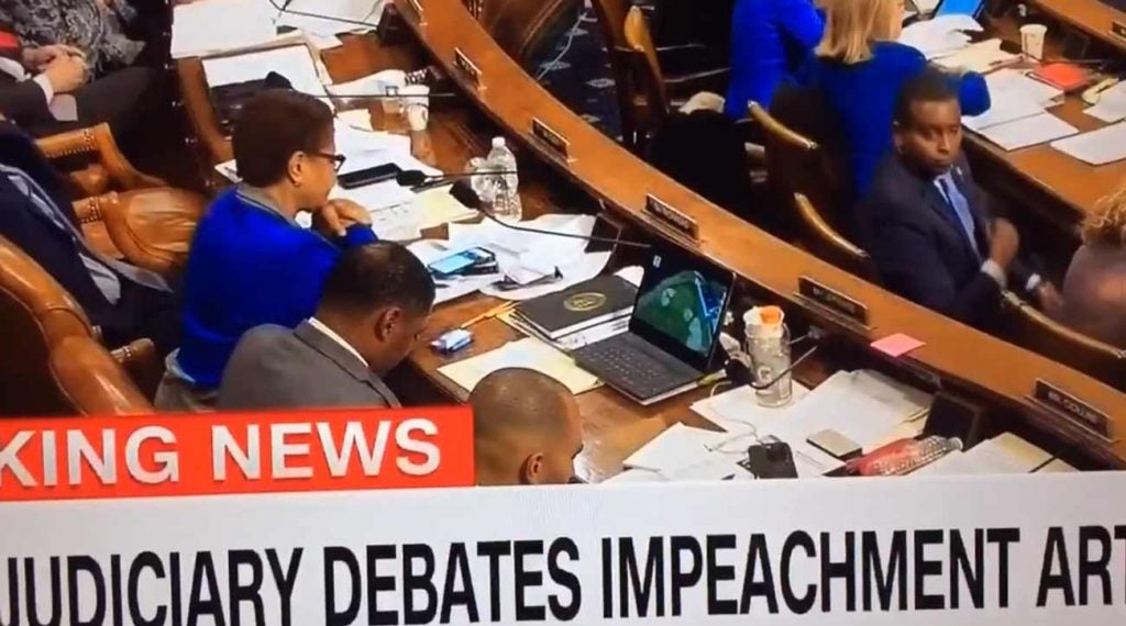 Rep. Cedric Richmond, D-La, was filmed streaming the Presidents Cup during the Trump impeachment debate Thursday night.