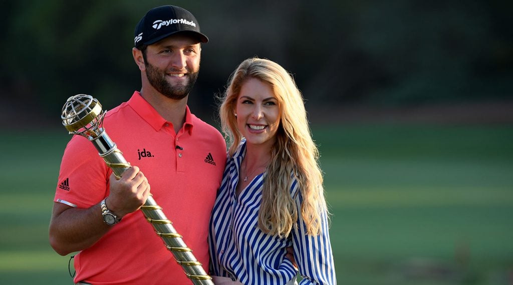 Jon Rahm and Kelley Cahill pose for a picture after Rahm won the DP World Tour Championship on Nov. 24 in Dubai.