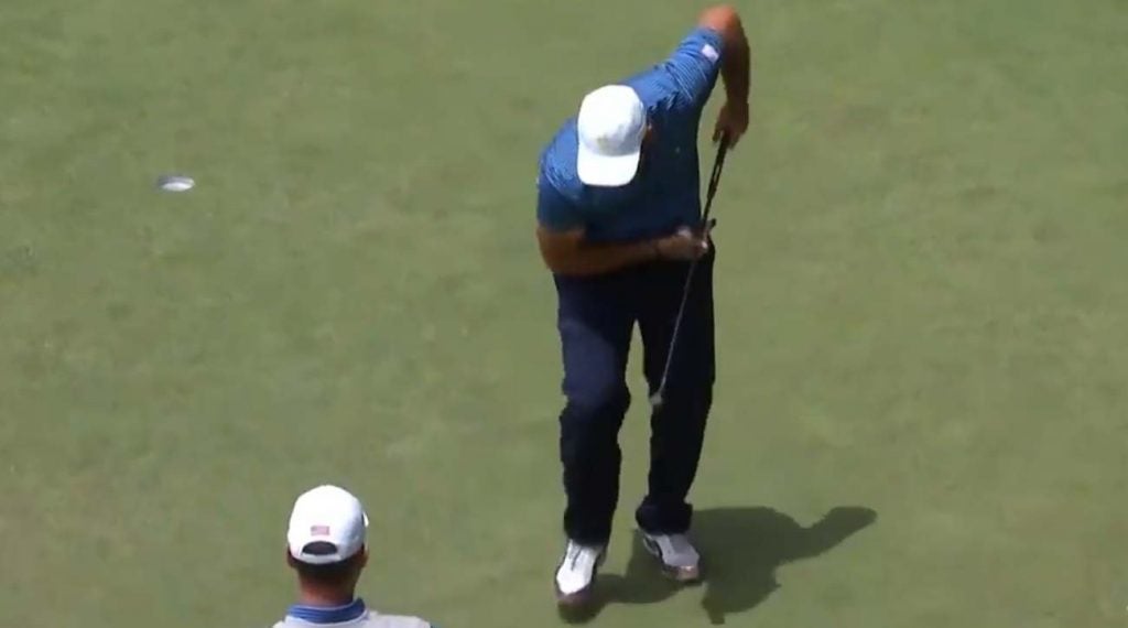 Patrick Reed makes a shovel gesture after a birdie on Day 2 at the 2019 Presidents Cup.