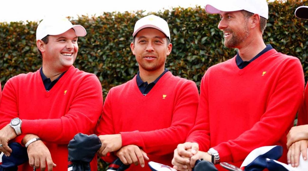 U.S> Presidents Cup team mmembers Patrick Reed, Xander Schauffele (center) and Webb Simpson (right) pose for photos yesterday at Royal Melbourne.