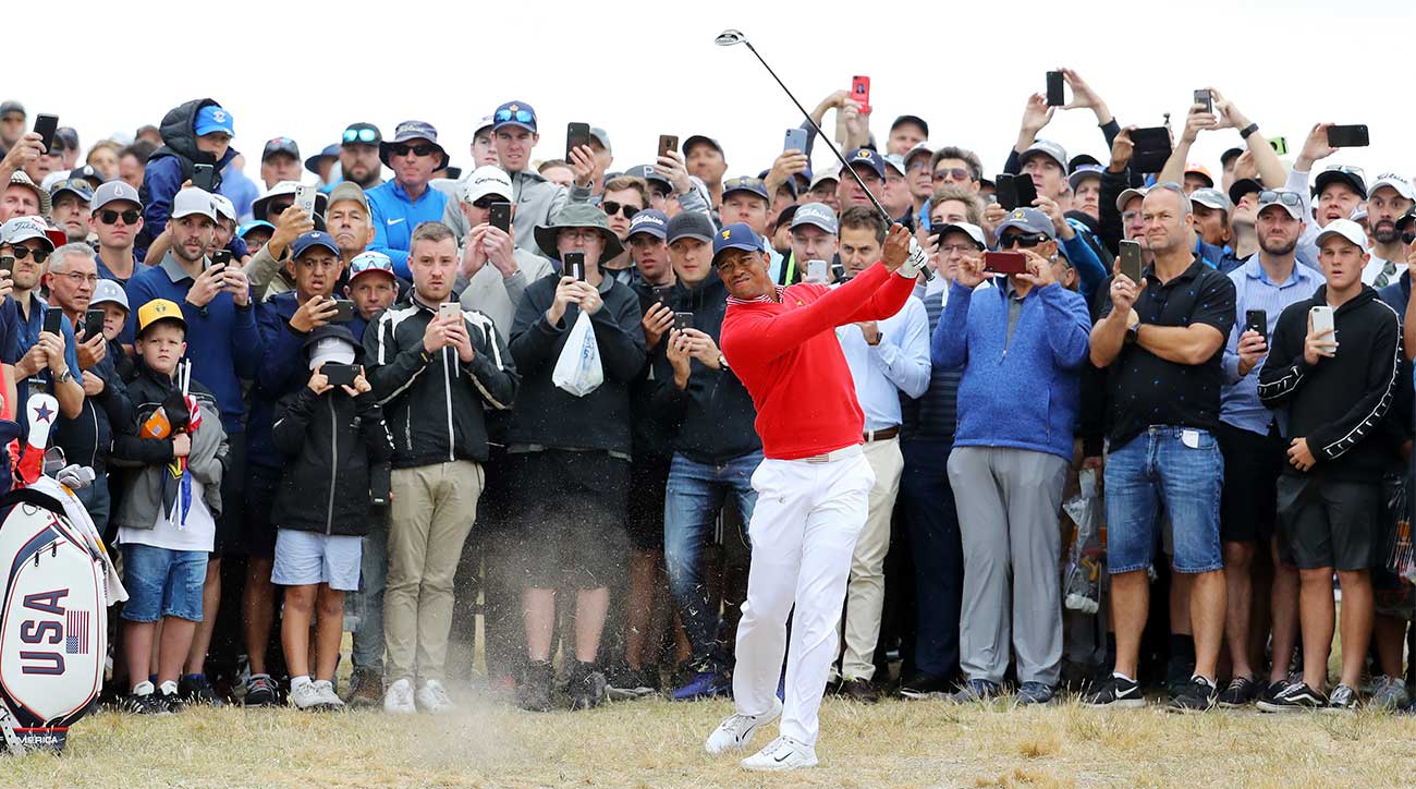 Tiger Woods hits an approach shot during the first session of the Presidents Cup on Thursday.