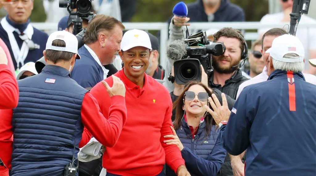 Tiger Woods and his U.S. teammates celebrate during Sunday singles at the Presidents Cup on Sunday at Royal Melbourne in Australia.