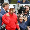 Tiger Woods and his U.S. teammates celebrate during Sunday singles at the Presidents Cup on Sunday at Royal Melbourne in Australia.