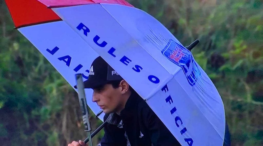 Joaquin Niemann borrowed a rules official's umbrella, only once his umbrella was broken.