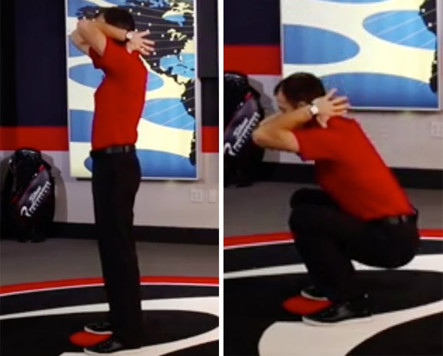 A Titleist Performance Institute coach demonstrates the early extension squat test. 