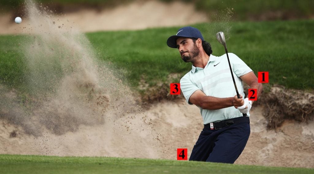 Abraham Ancer blasts out of a bunker at the Australian Open.