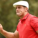Bryson DeChambeau waves to the crowd at the Presidents Cup.