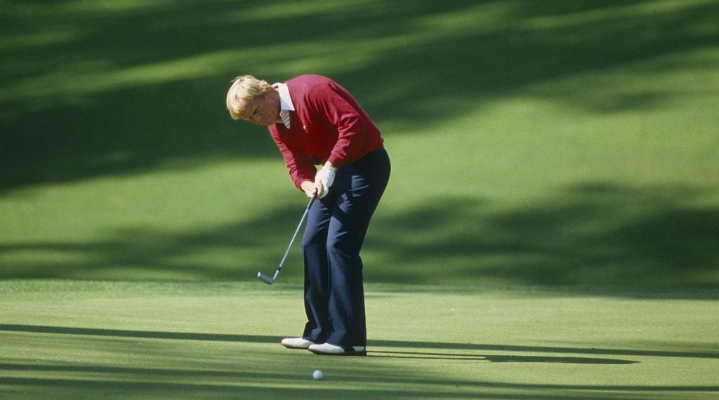 Jack Nicklaus hits a putt at the Masters.