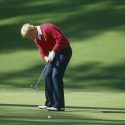 Jack Nicklaus hits a putt at the Masters.