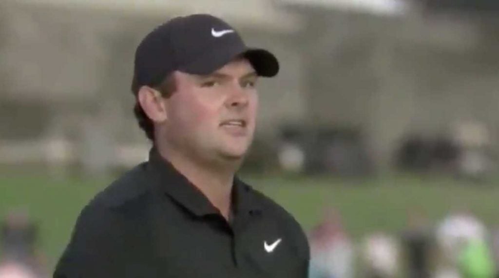 Patrick Reed glares at a fan in the crowd during the playoff.