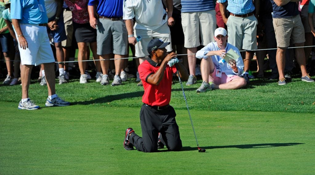 Tiger Woods doubles over in pain during the Final Round of The Barclays.