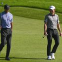 Tiger Woods and Collin Morikawa talk during the opening round at the 2020 Farmers Insurance Open