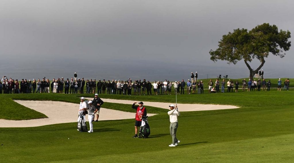 Tiger Woods plays the fifth hole on Torrey Pines' South Course on Friday.