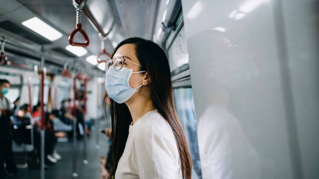 A woman in Hong Kong wears a mask to protect against the coronavirus.