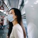 A woman in Hong Kong wears a mask to protect against the coronavirus.